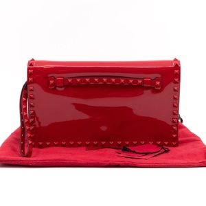 Valentino Garavani Rockstud Flap Clutch. Red patent leather.